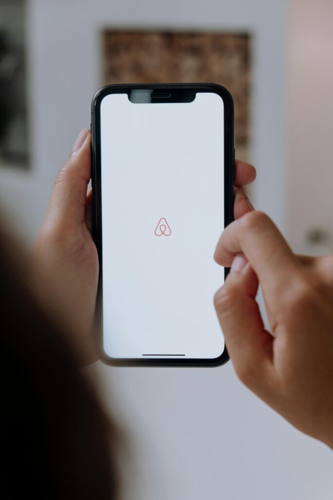 Airbnb brand logo on a cell phone.